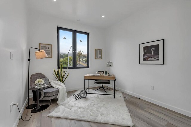 office area with light hardwood / wood-style flooring