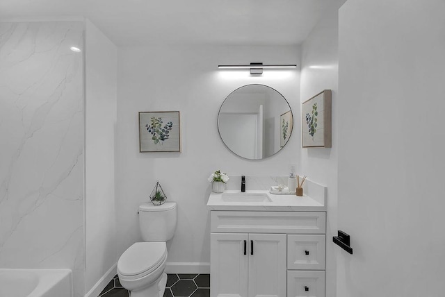 bathroom featuring toilet, vanity, and tile patterned floors