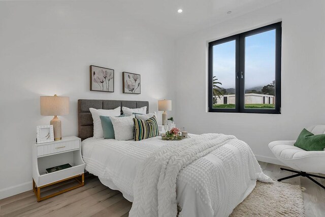 bedroom with light wood-type flooring