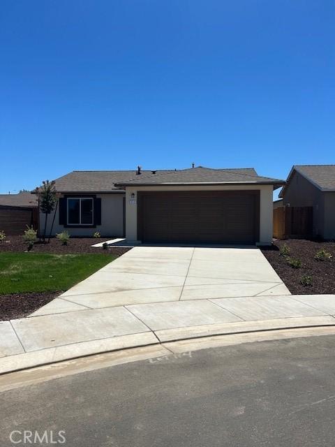 ranch-style house featuring a garage