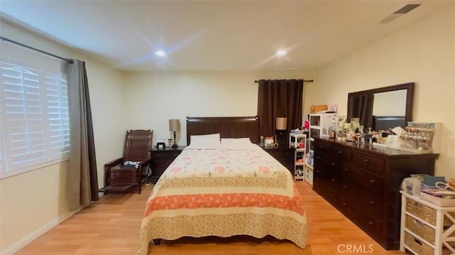 bedroom with light hardwood / wood-style floors