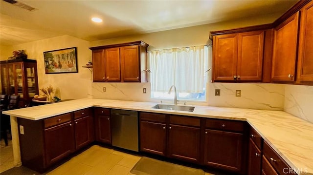 kitchen with kitchen peninsula, sink, and stainless steel dishwasher