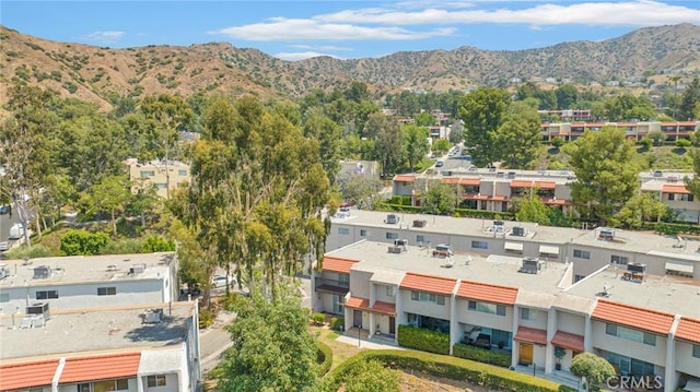 birds eye view of property featuring a mountain view