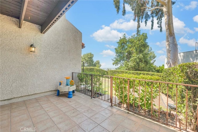 view of patio with a balcony