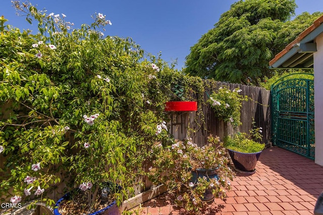view of patio / terrace with fence and a gate