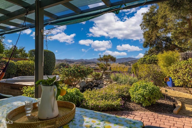 view of patio featuring a pergola and a mountain view