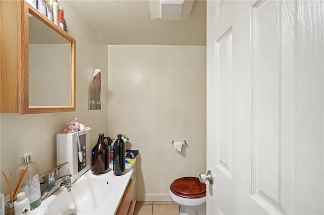 bathroom featuring tile patterned floors, sink, and toilet