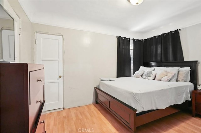 bedroom with light hardwood / wood-style floors