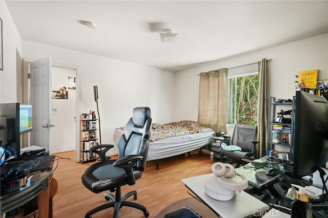 bedroom with light hardwood / wood-style floors