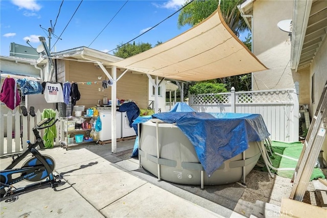 view of patio / terrace featuring a pool