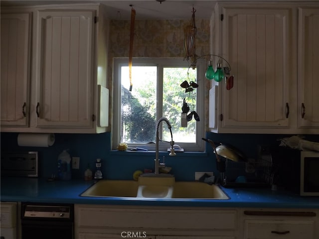 kitchen featuring dishwasher and sink