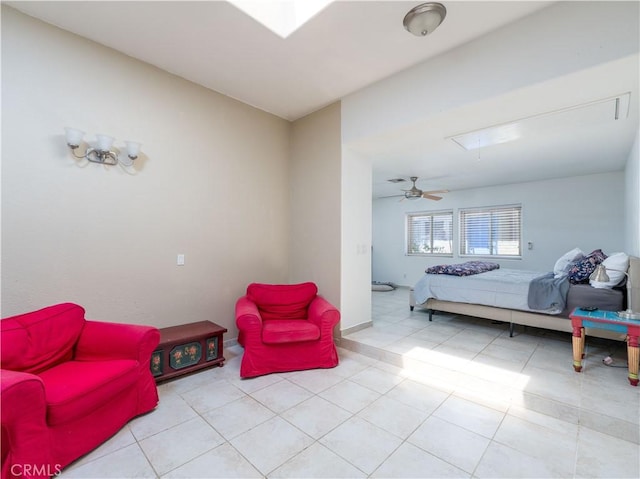 tiled bedroom featuring ceiling fan