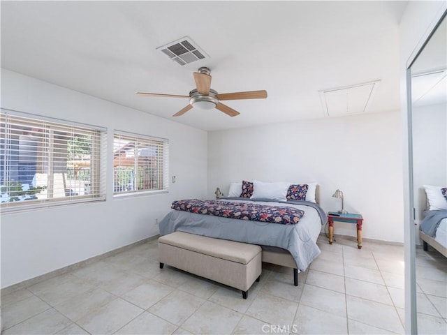 bedroom with ceiling fan and light tile patterned floors