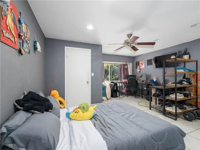 tiled bedroom with ceiling fan