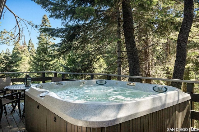 deck featuring a hot tub