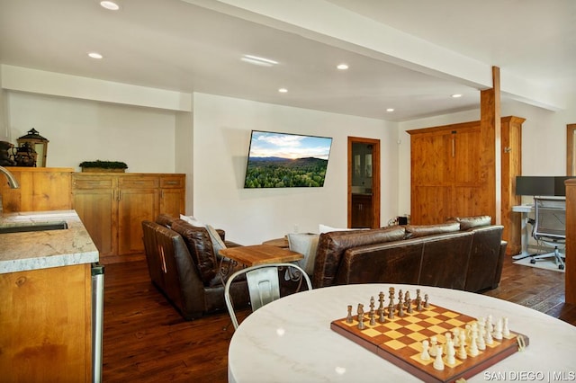 dining space with dark hardwood / wood-style floors and sink