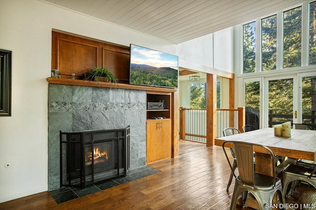 sunroom with a tiled fireplace