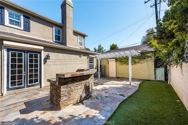 view of patio / terrace with a pergola and french doors