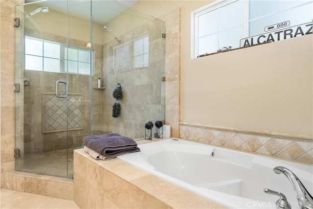 bathroom with shower with separate bathtub