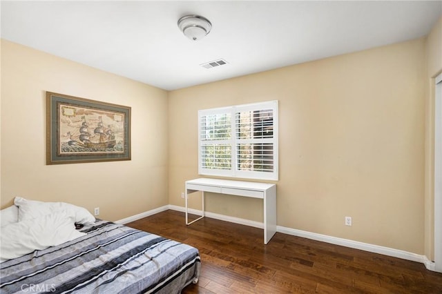 bedroom featuring dark hardwood / wood-style flooring