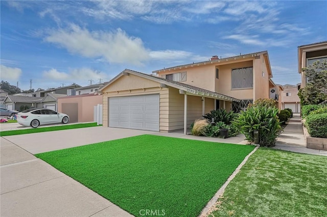 view of front facade with a garage and a front lawn