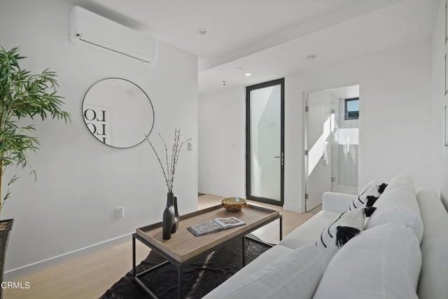 living room featuring light wood-type flooring and a wall mounted AC