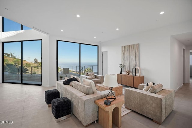 living room featuring plenty of natural light and a water view