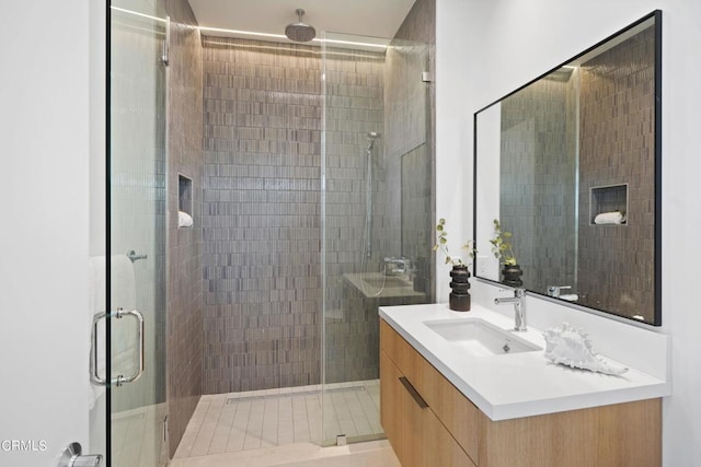 bathroom featuring vanity and walk in shower