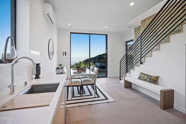 kitchen with sink and a wall mounted air conditioner