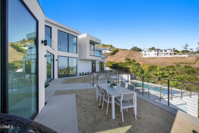 view of patio / terrace with a balcony