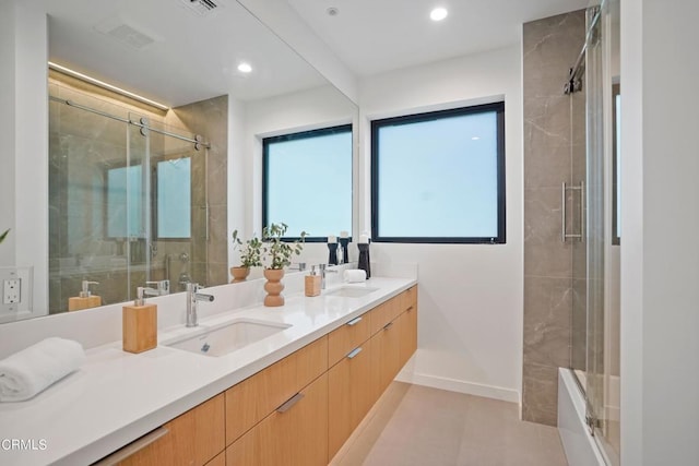 bathroom featuring vanity and a shower with shower door