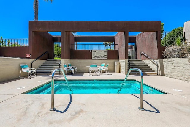 view of swimming pool featuring a patio