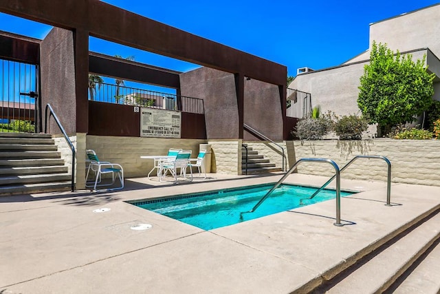 view of swimming pool featuring a patio