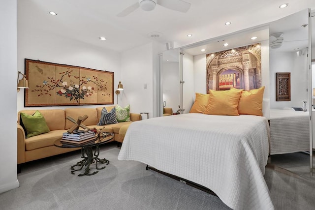 bedroom with ceiling fan and carpet floors