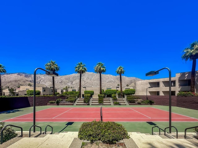 view of sport court with a mountain view and basketball court