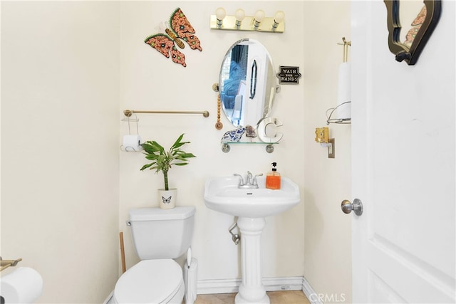 bathroom featuring tile patterned floors and toilet