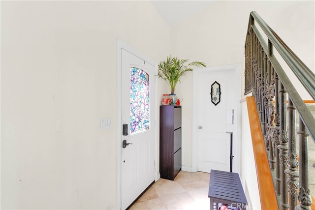 foyer entrance featuring light tile patterned flooring