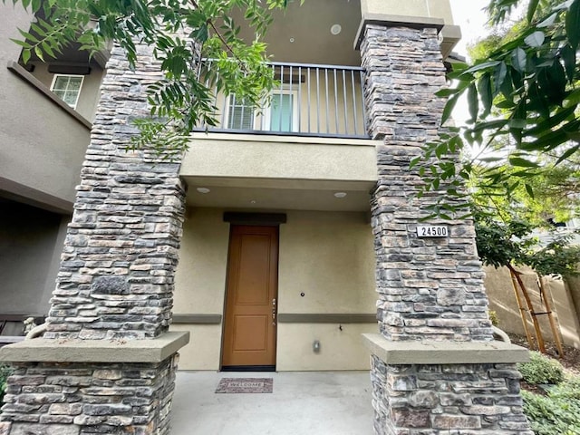 doorway to property featuring a balcony