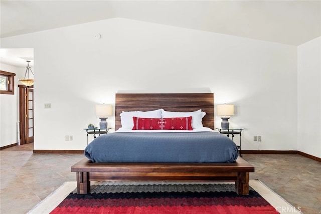 bedroom with lofted ceiling