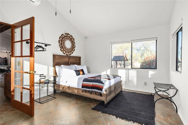 bedroom featuring french doors and lofted ceiling