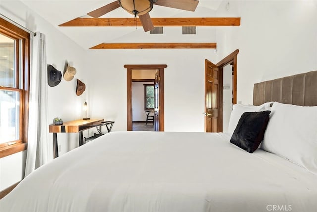 bedroom featuring lofted ceiling with beams and ceiling fan