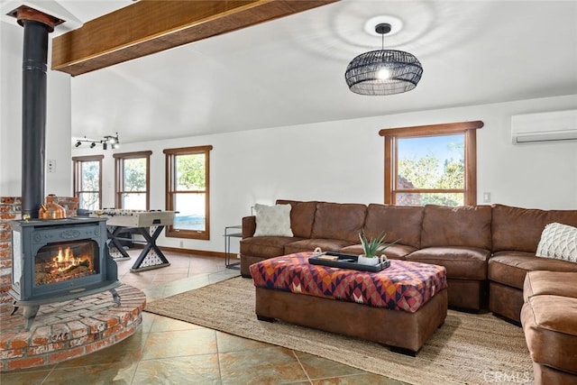 living room featuring a wall mounted AC, a healthy amount of sunlight, and a wood stove