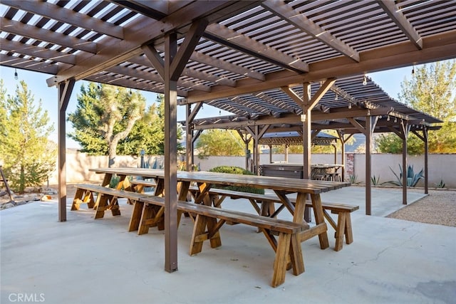 view of community with a pergola and a patio area