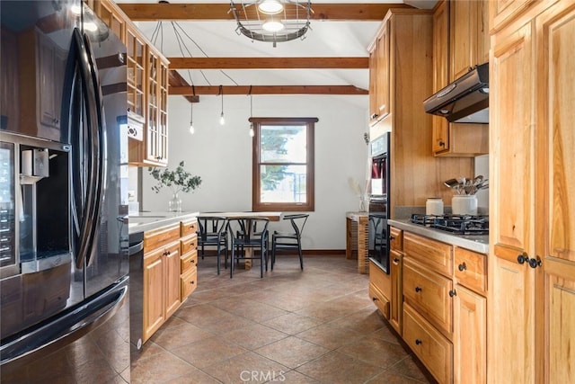 kitchen with black refrigerator with ice dispenser, stainless steel gas stovetop, vaulted ceiling with beams, and dark tile patterned floors