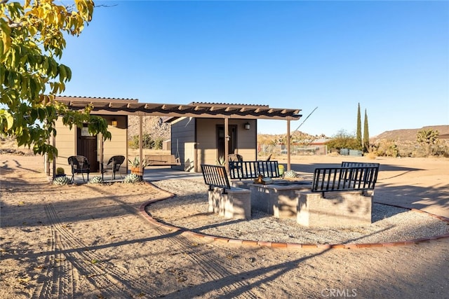 view of front of house featuring a patio and a pergola