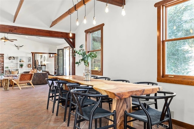 dining space with vaulted ceiling with beams, ceiling fan, and a wealth of natural light