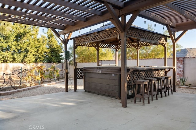 view of patio / terrace with a pergola and a bar