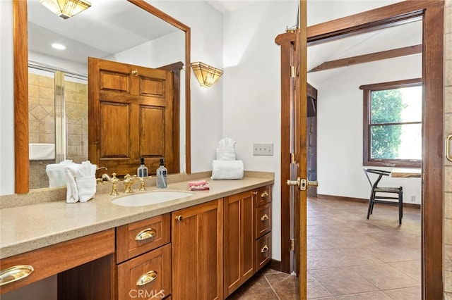 bathroom with vanity, tile patterned floors, and an enclosed shower