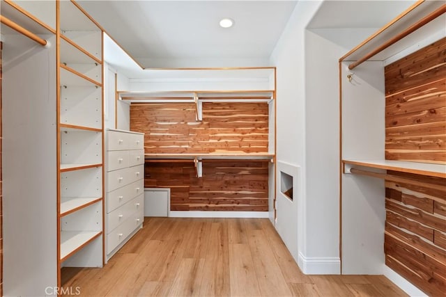 walk in closet featuring light hardwood / wood-style floors