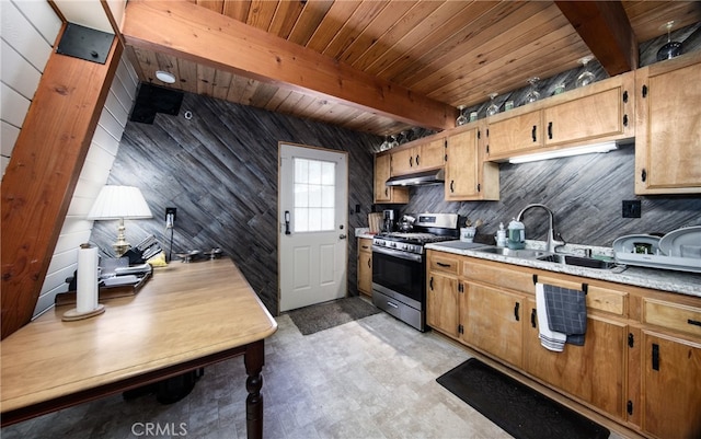 kitchen featuring wooden ceiling, beam ceiling, gas stove, wooden walls, and sink